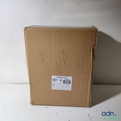 a cardboard box with a sticker on it sitting on a table