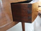a wooden table with a drawer underneath it