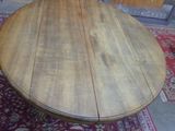 a wooden table that is sitting on a rug