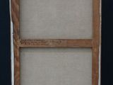 painting on a wooden easel against a black background