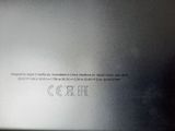 the back of a silver laptop with a black keyboard on it