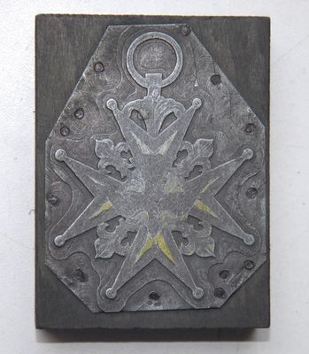 an image of a metal plaque with a star design on it