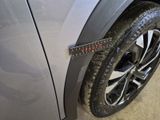 a measuring tape on the side of a car ' s tire