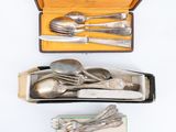 silverware in a box with a spoon and spoon rest
