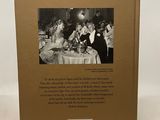 a book with a picture of a group of people sitting at a table