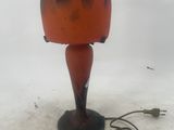 a red lamp that is sitting on the snow