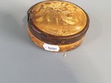 an image of a gold plated box on a white surface