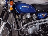 a blue motorcycle parked in a parking garage