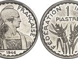 a silver coin with a picture of a woman and a bird on it