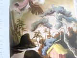 une image représentant un livre sur lequel figure un oiseau volant au-dessus d'une tente