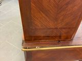a small wooden table with a drawer on top of it