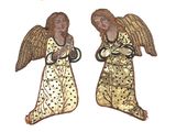 pair of gold angel ornaments on a white background with a star in the background
