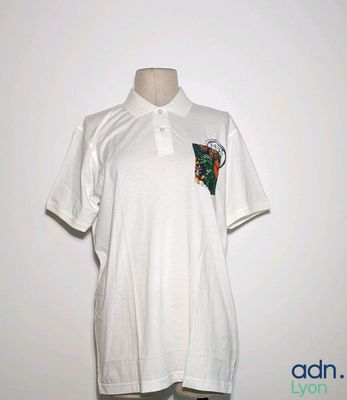 white polo shirt with a green and red design on the chest