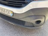 a close up of the front of a car with a number plate on it