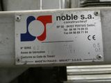 a sign on the side of a machine that says noble sa