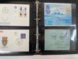a black binder with a picture of stamps on it