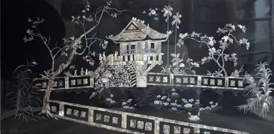 a black and white picture of a house and a pond