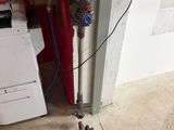 a picture of a vacuum and a dryer in a room