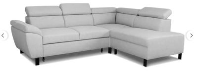 a picture of a white leather sectional sofa with a chaise