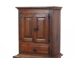 an old wooden cabinet with two drawers and a drawer underneath it