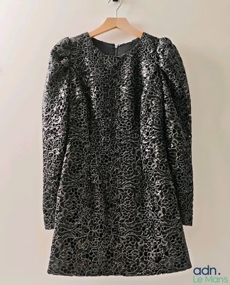 a black and white leopard print dress hanging on a hanger