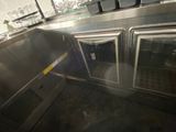 two ovens that are in the middle of a kitchen