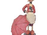 une figurine représentant une femme avec un parapluie rouge