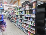 shelves in a grocery store filled with lots of different types of cleaning products
