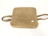 an image of a small tan bag with a brown handle