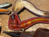 a pair of shoes and a pipe sitting on a table
