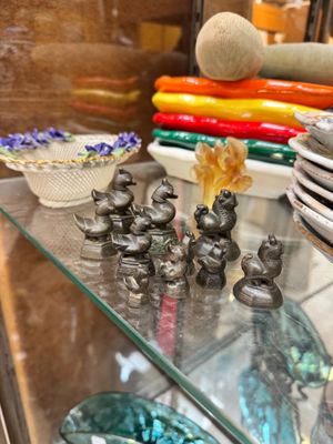 a glass display case with many different items on it