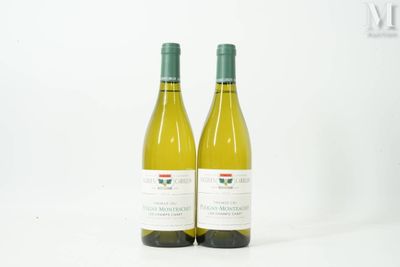 two bottles of wine sitting next to each other on a table