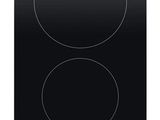 a black stove top with two burners on it