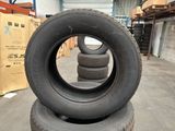tires stacked on top of each other in a warehouse