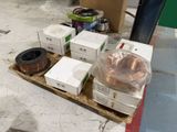 many boxes of different types of wires on the floor