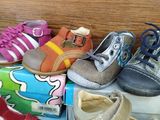 many pairs of shoes sitting on the floor next to each other
