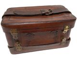 a brown suitcase that is sitting on a white surface