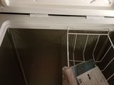 a cooler that is open and has some papers in it