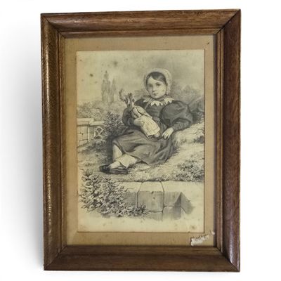 an old picture of a woman holding a baby in her lap