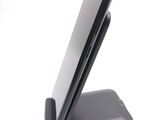 a cell phone that is sitting on top of a stand