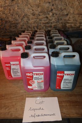 a lot of different colored liquids on a table