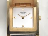 an image of a close up of a watch on a white surface