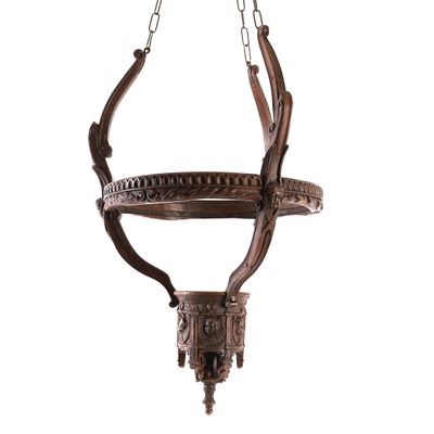 a large wooden chandelier hanging from a chain