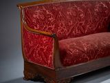 an image of a red couch on a grey background