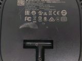 an image of a close up of a wireless device with a cable