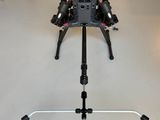 an image of a camera tripod on a tripod stand in a room