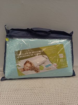 a close up of a blue bag with a baby in it