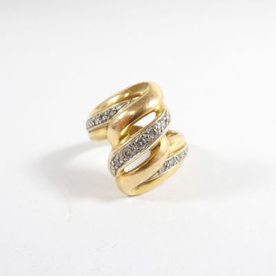 an image of a gold and diamond ring on a white surface
