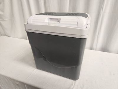 an image of a small refrigerator on a white table