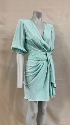 an image of a mannequin wearing a green dress on a mannequin mannequin